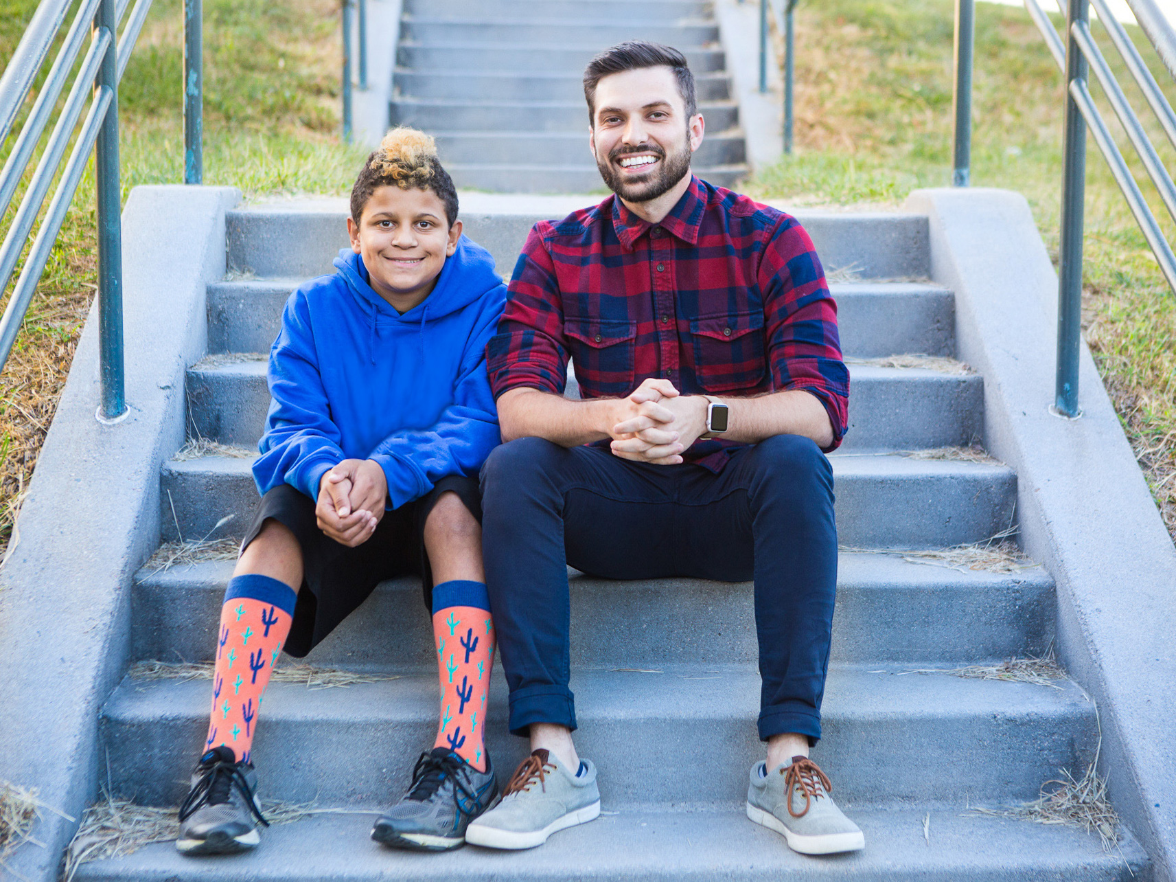 Mentor Man with Boy on Stairs Smiling